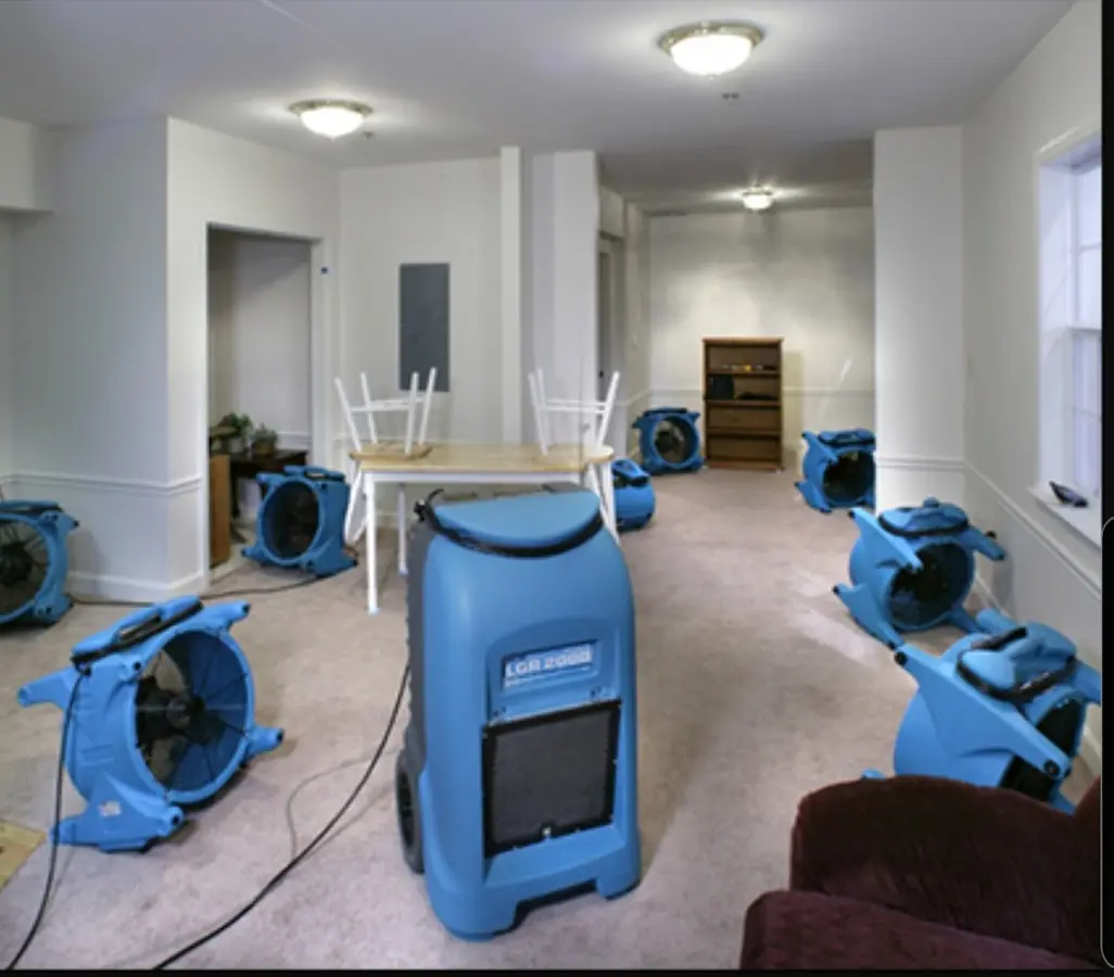 Air movers and dehumidifier setup for Water Damage Restoration in Stroud