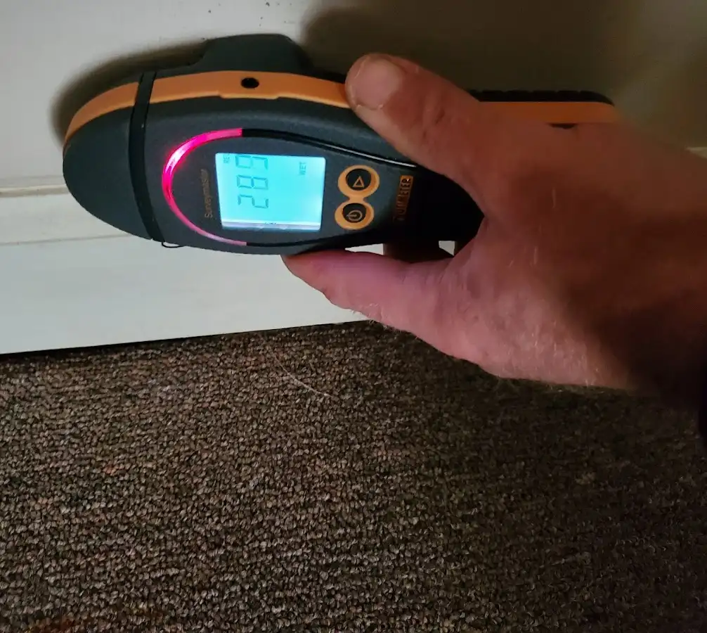 Moisture detection at baseboard during Sewage Cleanup & Sanitation in Stroud